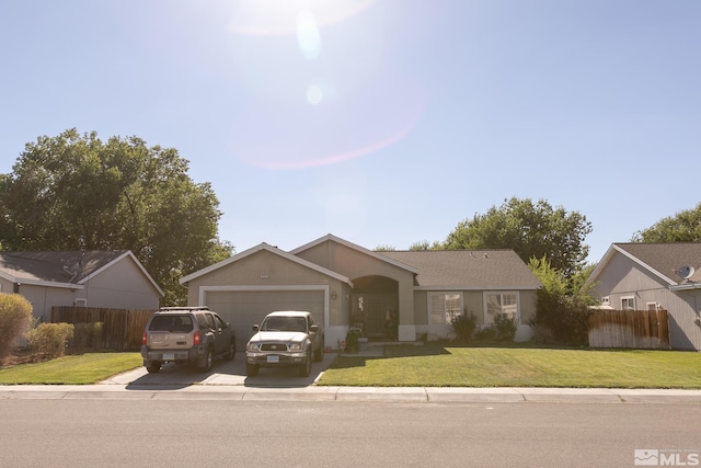 single story home with a garage and a front yard