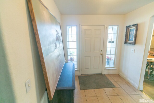 bathroom with tile patterned floors, independent shower and bath, and toilet