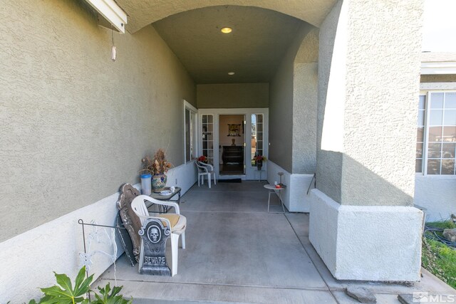 ranch-style home featuring a garage and a front lawn