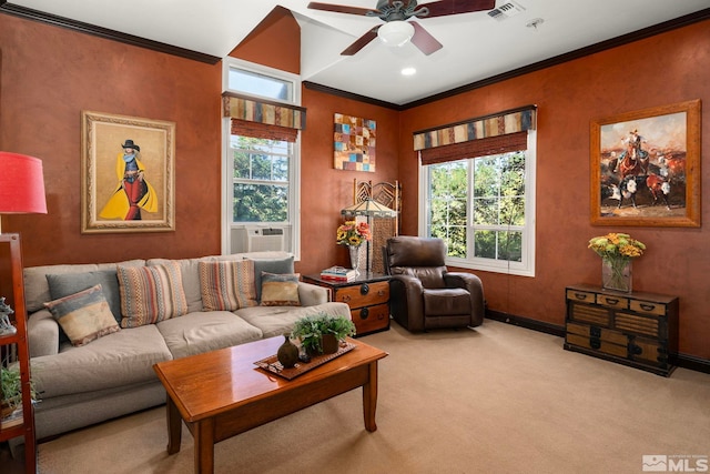 living room with crown molding, ceiling fan, plenty of natural light, and carpet