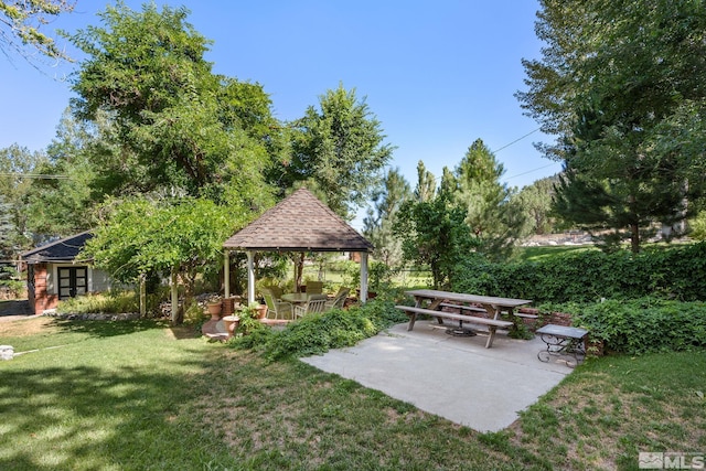 view of yard featuring a gazebo and a patio