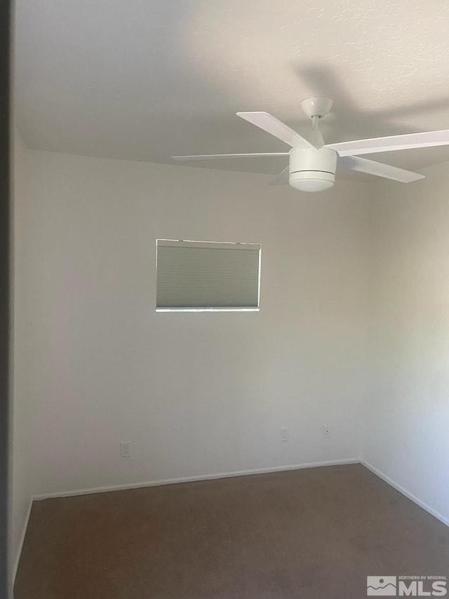 spare room with carpet and ceiling fan