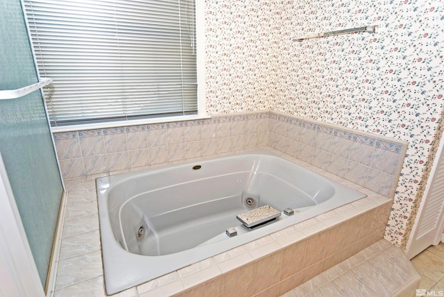 bathroom featuring tiled bath