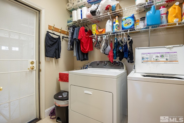 clothes washing area featuring independent washer and dryer