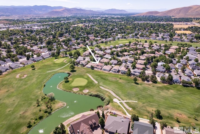 birds eye view of property with a water and mountain view