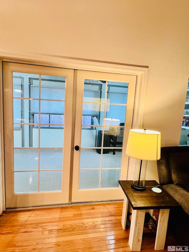 doorway to outside featuring french doors and light hardwood / wood-style floors