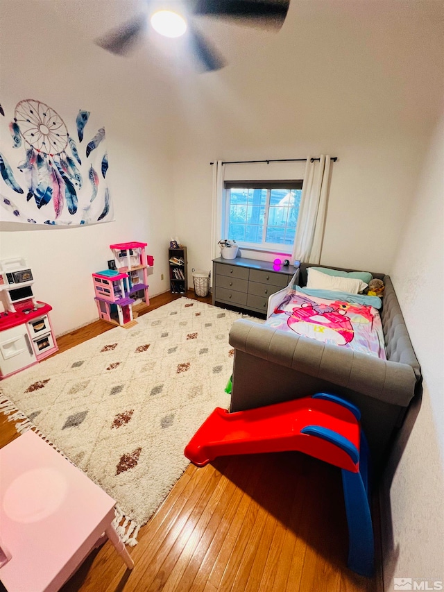 bedroom featuring hardwood / wood-style floors and ceiling fan