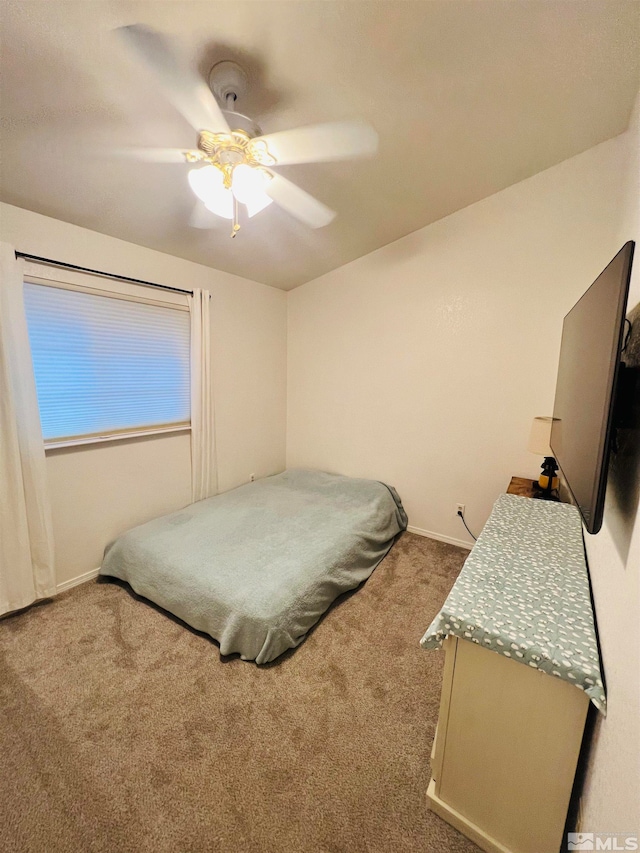 bedroom with ceiling fan and light colored carpet