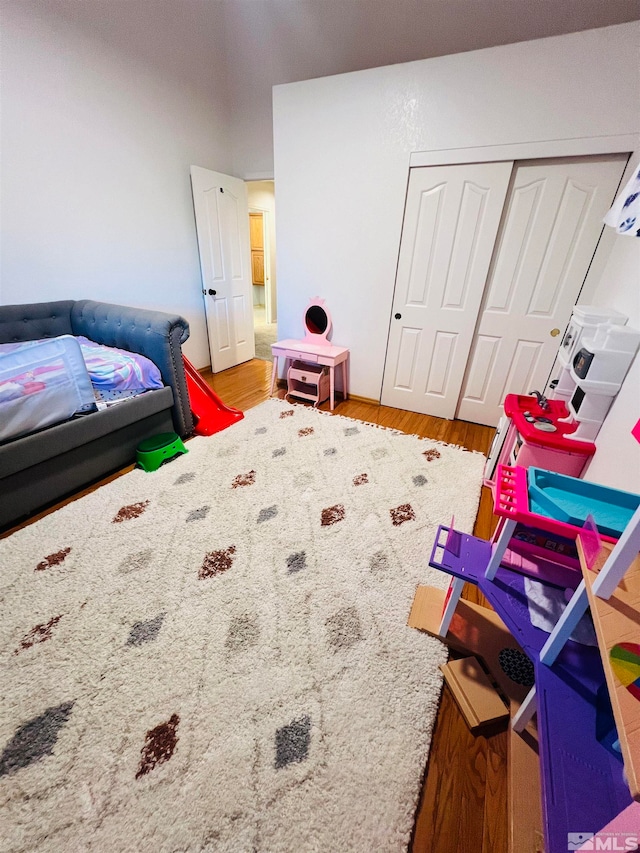 bedroom featuring light hardwood / wood-style flooring and a closet