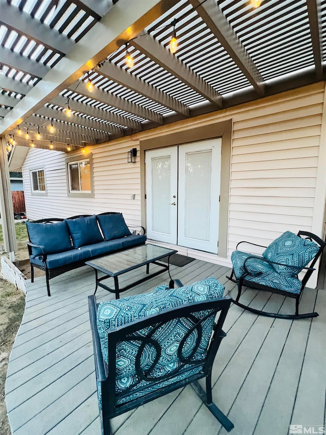 wooden deck with a pergola and an outdoor living space