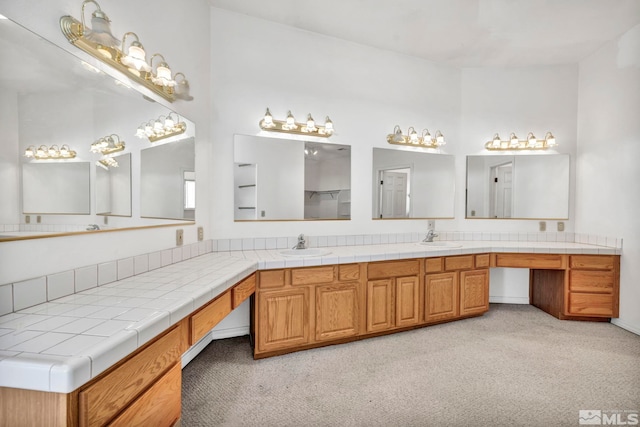 bathroom featuring dual vanity