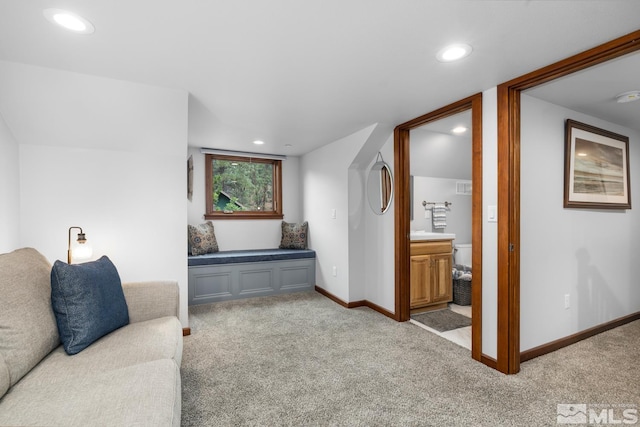 living room featuring light colored carpet