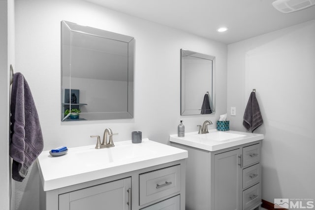 bathroom featuring double vanity