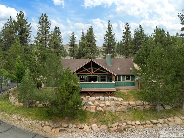 exterior space featuring a wooden deck