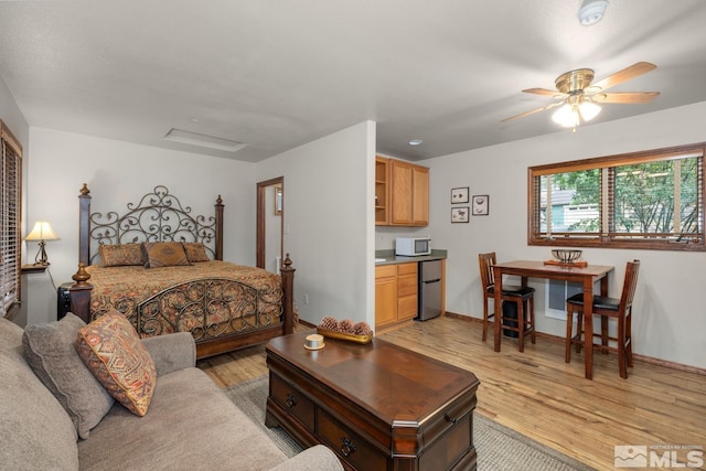 bedroom featuring ceiling fan and light hardwood / wood-style flooring