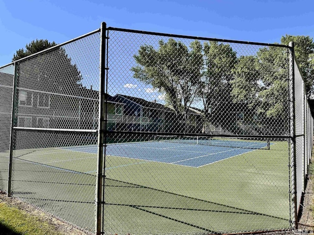 view of sport court with fence