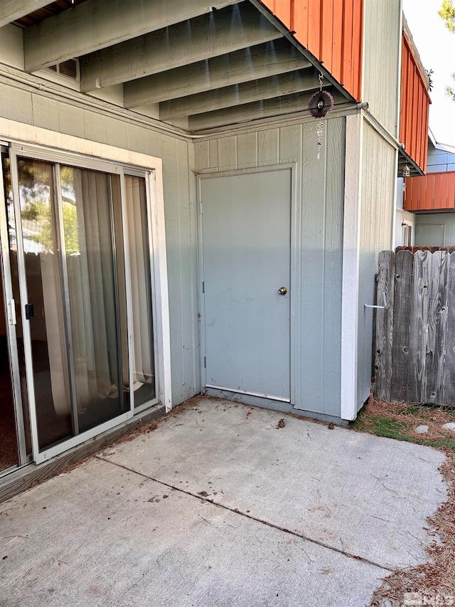 doorway to property featuring a patio area