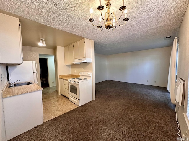 kitchen with light countertops, hanging light fixtures, white cabinetry, white appliances, and under cabinet range hood