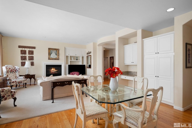 dining area with light hardwood / wood-style floors