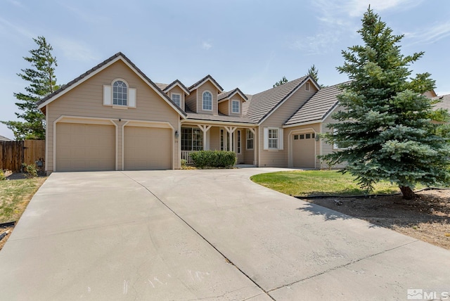 view of front of property featuring a garage and a front yard