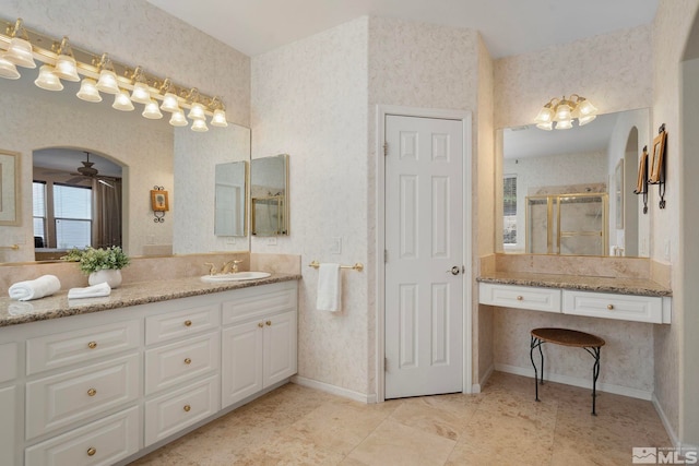 bathroom with an enclosed shower, vanity, and ceiling fan