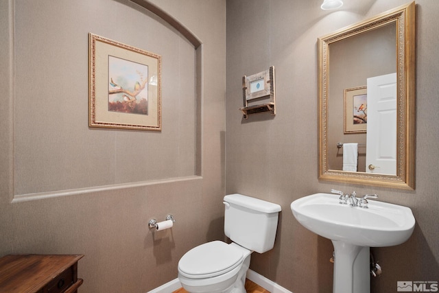 bathroom featuring sink and toilet