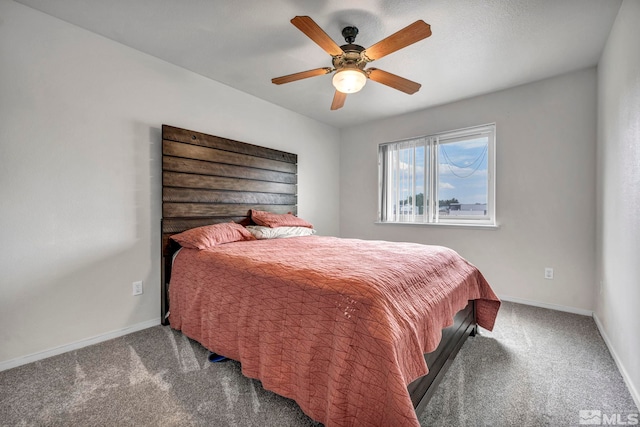 bedroom featuring ceiling fan, carpet floors, and baseboards