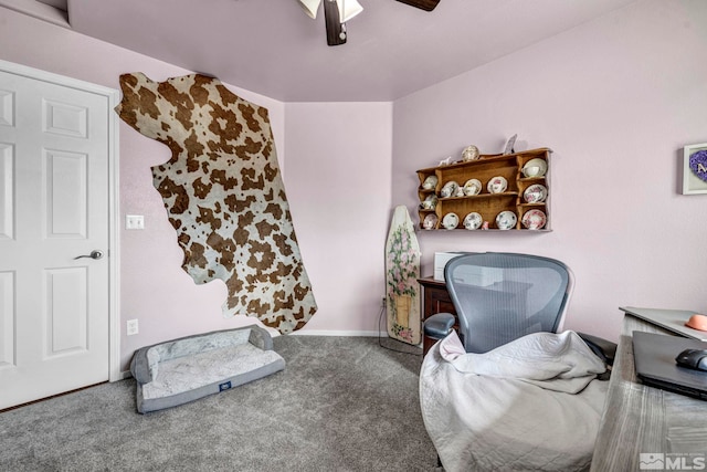 interior space featuring carpet floors, a ceiling fan, and baseboards