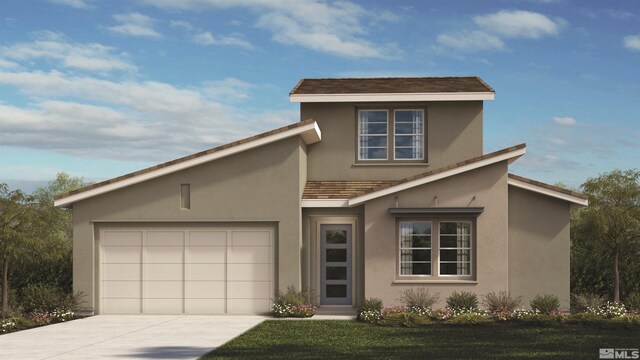 view of front of home featuring a front yard and a garage