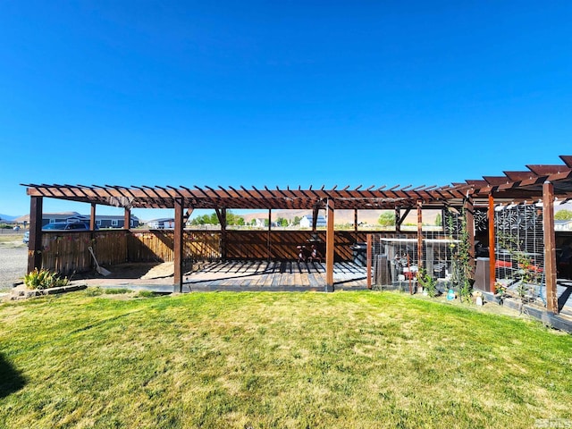 view of yard featuring fence and a pergola