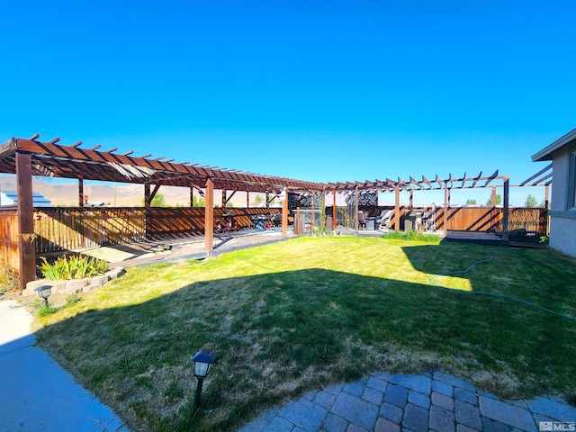 view of yard with a fenced backyard and a pergola