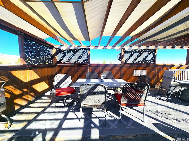 view of patio with outdoor dining area and a pergola