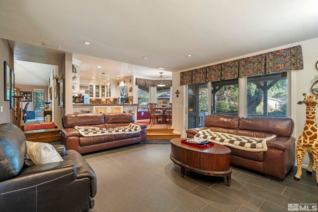 living room with a textured ceiling