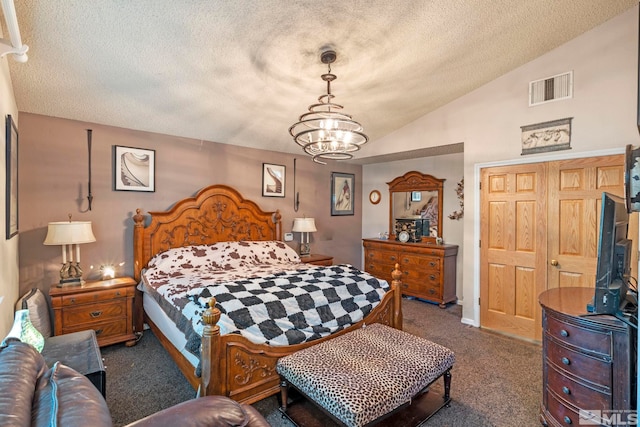 bedroom featuring visible vents, lofted ceiling, dark colored carpet, a textured ceiling, and a notable chandelier