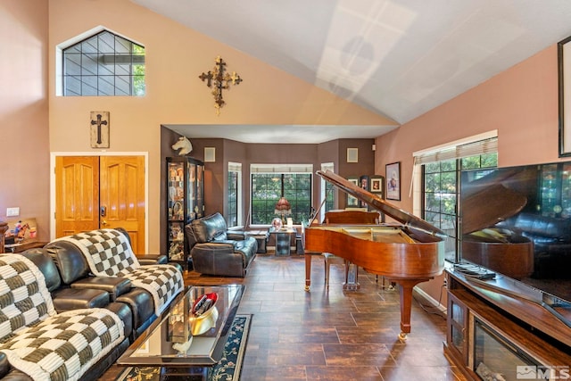 living room featuring a wealth of natural light and lofted ceiling