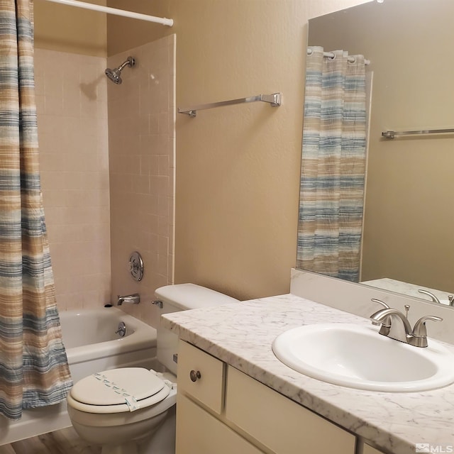 full bathroom with vanity, toilet, and shower / bath combo with shower curtain