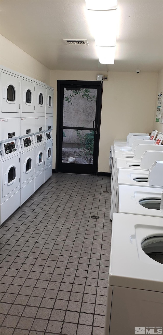 washroom featuring separate washer and dryer and stacked washer and clothes dryer