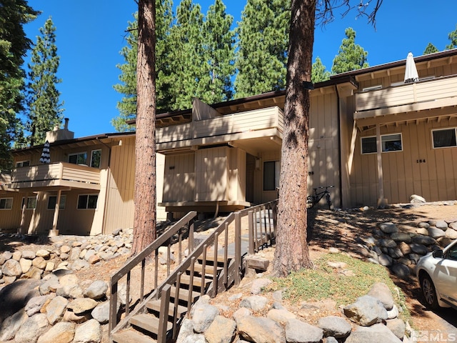 view of home's exterior with stairs