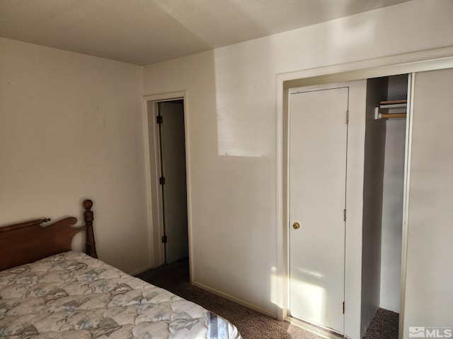 carpeted bedroom with a closet