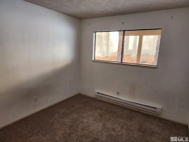 carpeted spare room with a textured ceiling, a baseboard radiator, and baseboards