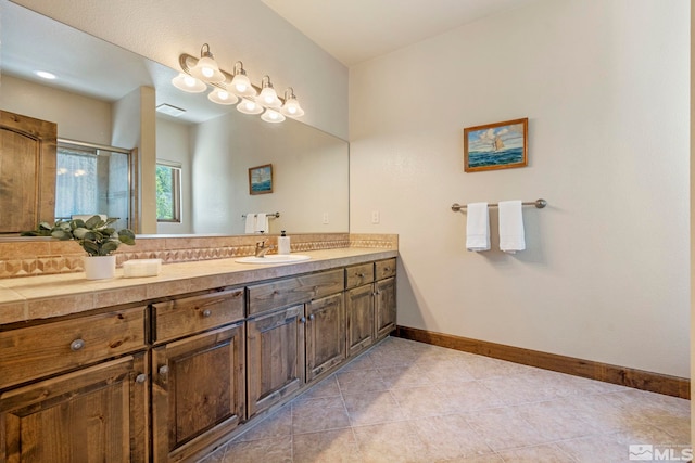 bathroom with vanity and tile patterned floors