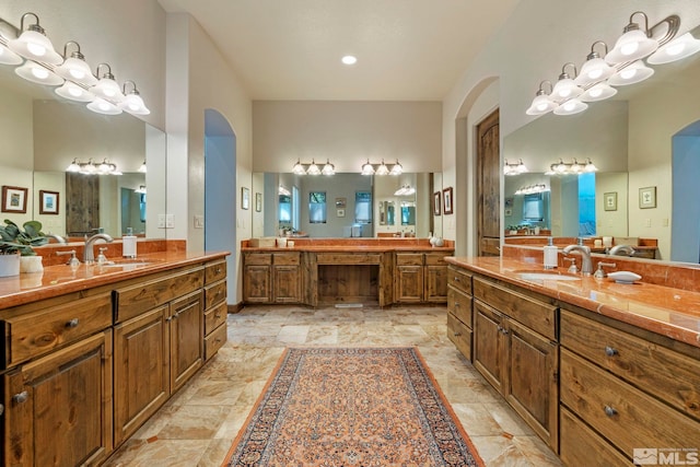 bathroom with dual vanity and tile patterned floors