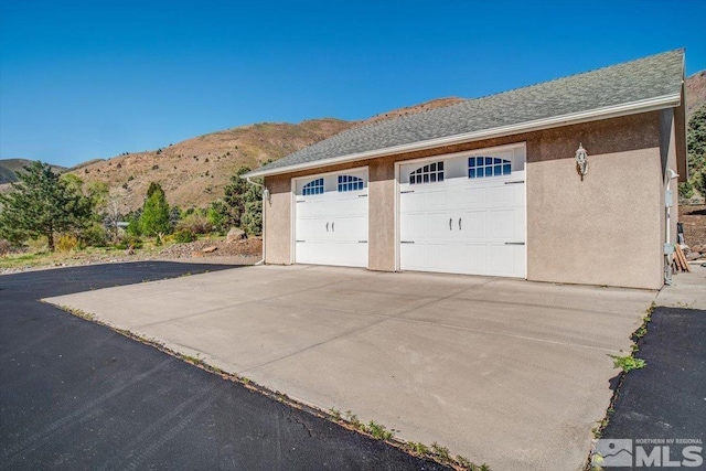 detached garage with a mountain view