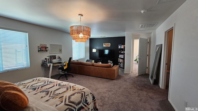 bedroom with carpet flooring and an inviting chandelier