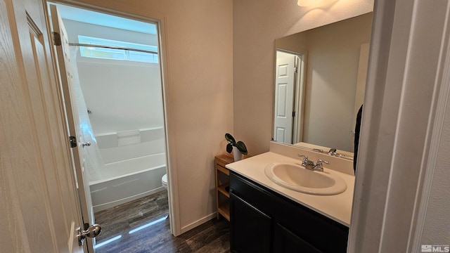 full bathroom featuring shower / bath combo with shower curtain, vanity, toilet, and hardwood / wood-style floors