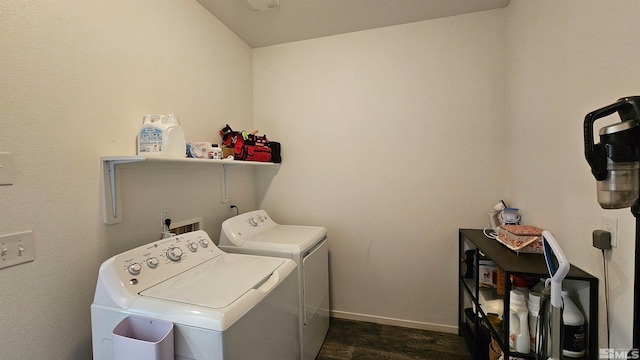 clothes washing area featuring separate washer and dryer and dark hardwood / wood-style floors