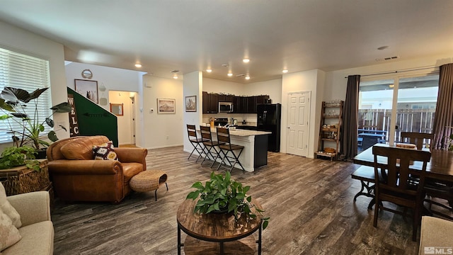 living room with dark hardwood / wood-style floors