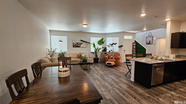 dining room with sink and dark wood-type flooring