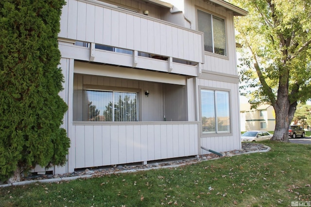 view of side of home featuring a yard