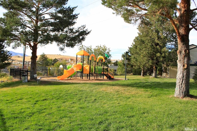 community jungle gym with a lawn